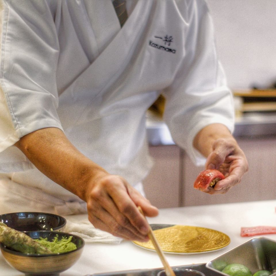 A chef plating at the counter