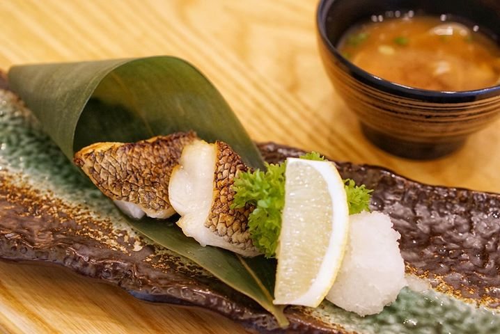 Grilled cod fish served on a leaf