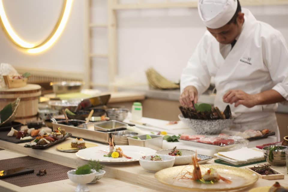 Sashimi served on a wooden boat