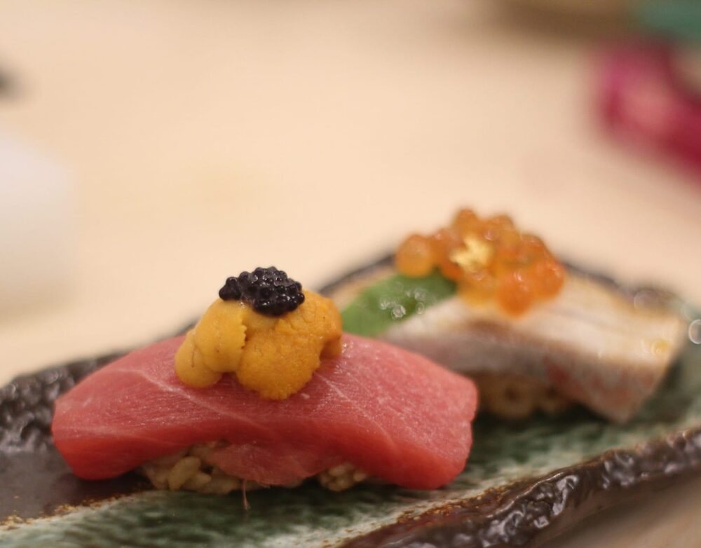 Otoro nigiri topped with sea urchin