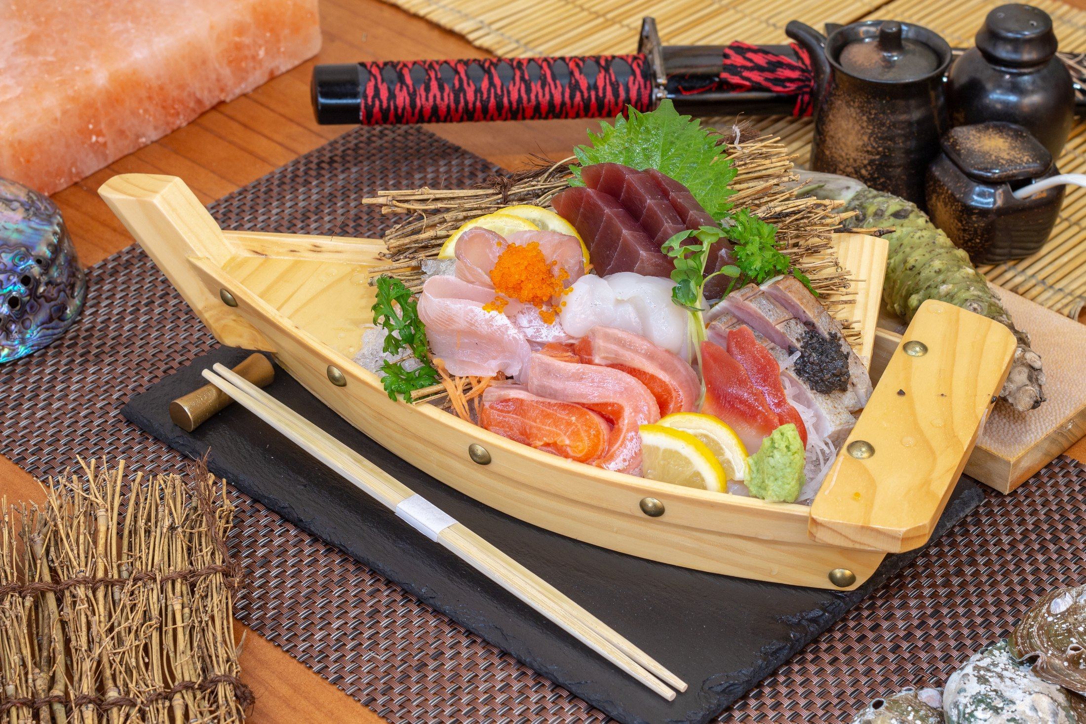 Sashimi moriawase served on a wooden boat at Kazumasa Penang