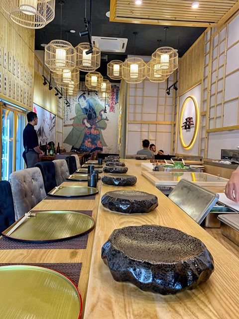 The hinoki counter at Kazumasa, set with stone rests and brass plates